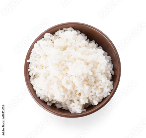 Bowl with tasty rice on white background