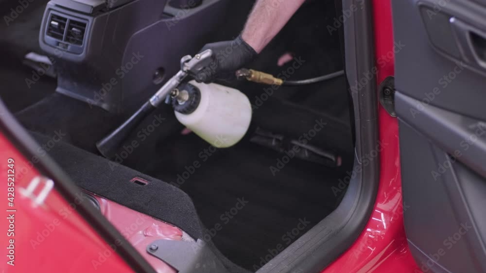 Professional car cleaning. Сar wash. Interior detailing. Dry clean and detail a car interior. Deep seats cleaning. Wiping foam in car wash. Cleaning the car panel from dust. A vacuum cleaner Professional car cleaning. Сar wash. Interior detailing. Dry clean and detail a car interior. Deep seats cleaning. Wiping foam in car wash. Cleaning the car panel from dust. A vacuum cleaner