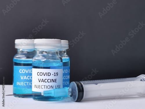Vaccine concept of fight against corona virus. Vaccine concept of fight against corona virus. Vaccine and syringe injection. It use for immunization and treatment from covid 19 infection.