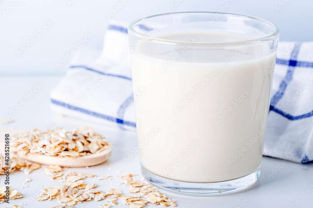 Home Cooking oat vegetable milk in glass. Homemade food concept. Plant based organic veggie milk, lactose free Home Cooking oat vegetable milk in glass. Homemade food concept. Plant based organic veggie milk, lactose free