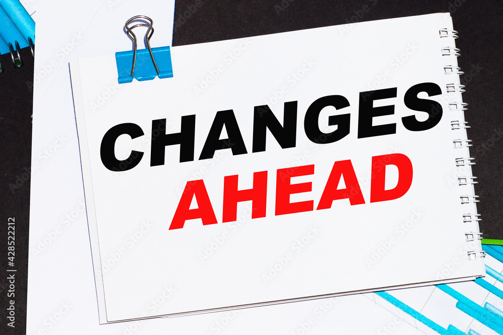 Naklejka premium Business concept. List with text sheet CHANGES AHEAD of paper for notes