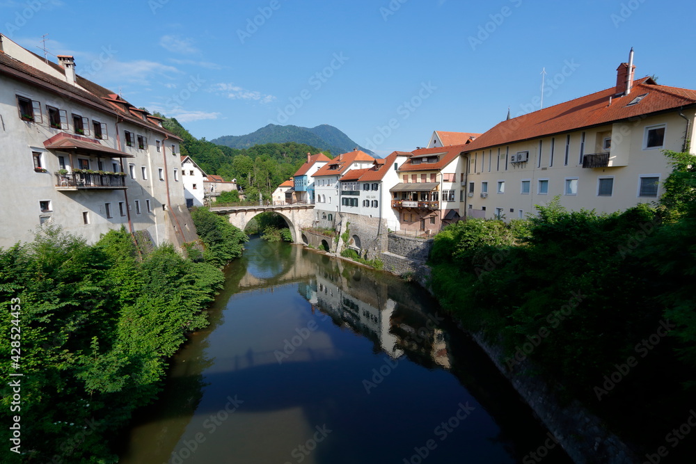 river run across the city of Skofja-Loka, Slovenia. Old walled city