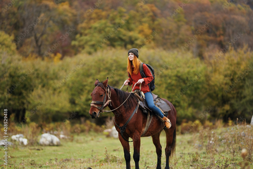 Woman riding horse outdoors fresh air travel landscape Woman riding horse outdoors fresh air travel landscape
