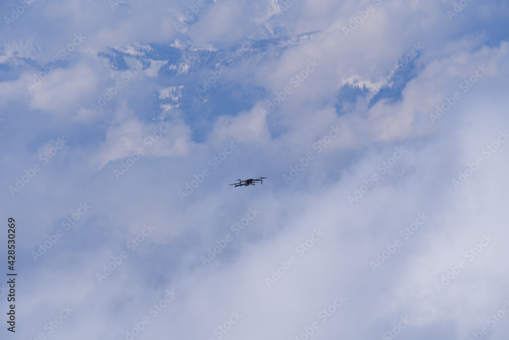Drone up in the air with Swiss alps in the background. Photo taken April 14th, 2021, Rigi Kulm, Switzerland.