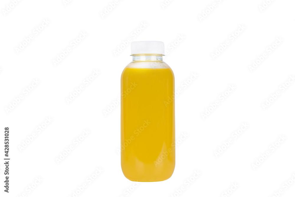 Yellow drink in a plastic bottle on a white background. Yellow drink in a plastic bottle on a white background.