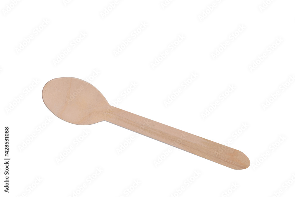 Small spoon made of wood on a white background. View from above. Small spoon made of wood on a white background. View from above.