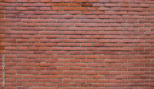 background of red brick wall texture. Home or office design backdrop texture of red brick wall.