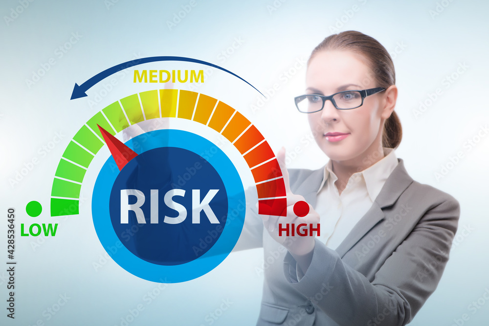Businesswoman in risk metering and management concept Businesswoman in risk metering and management concept