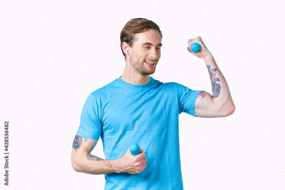 machine with tattoos on arms and blue dumbbells fitness bodybuilders machine with tattoos on arms and blue dumbbells fitness bodybuilders