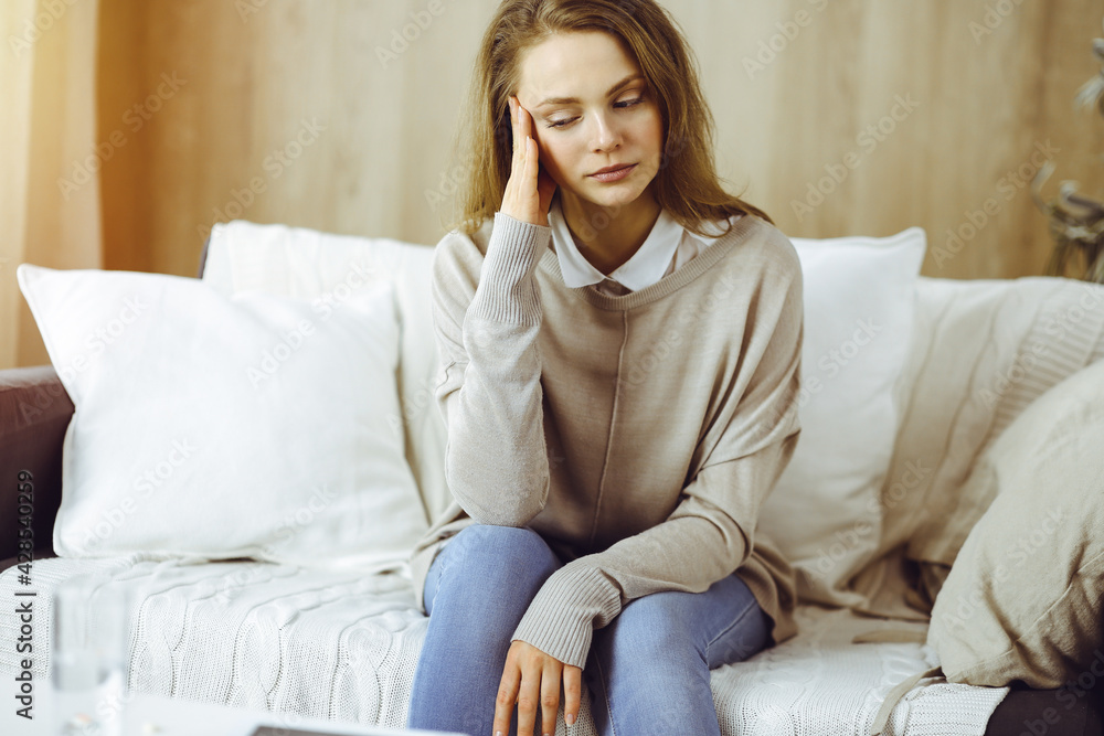 Tired upset woman worried about tiredness from domestic work and self isolation quarantine for COVID-19 Coronavirus Tired upset woman worried about tiredness from domestic work and self isolation quarantine for COVID-19 Coronavirus