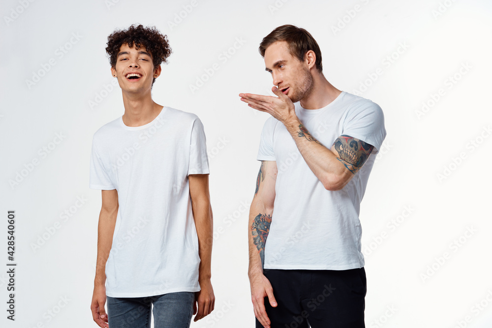two friends in white t-shirts communication fun positive two friends in white t-shirts communication fun positive
