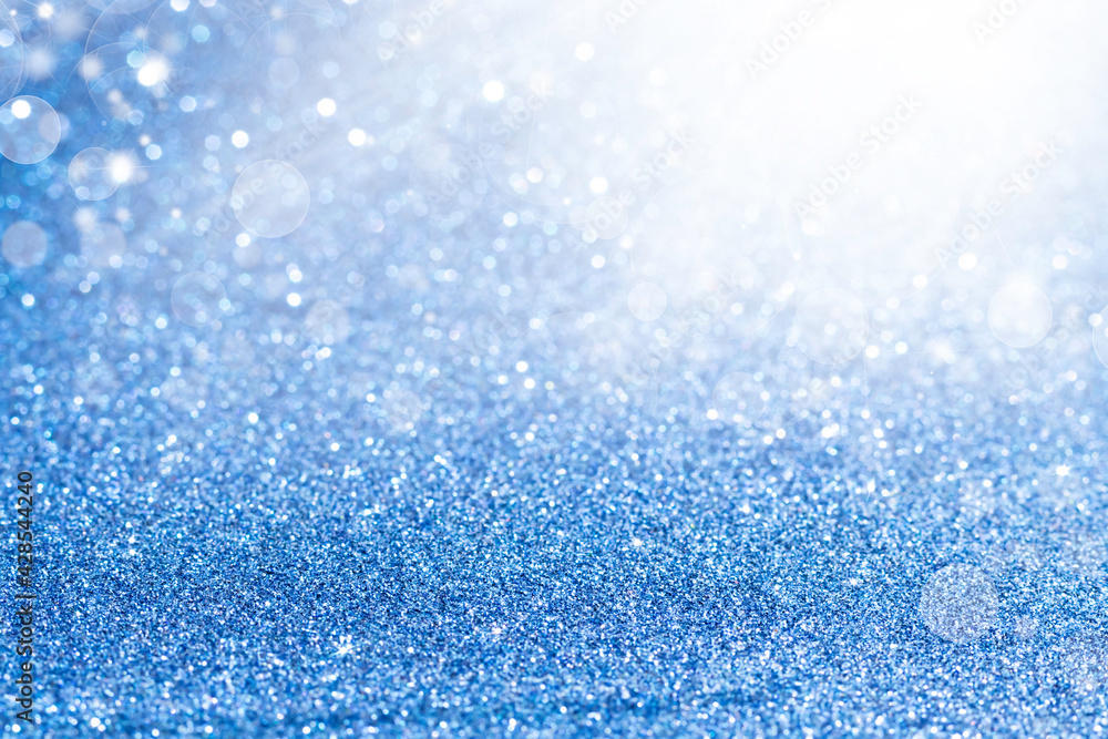 Shiny blurred blue background with bokeh for a festive mood. Greeting card template for fun. Shiny blurred blue background with bokeh for a festive mood. Greeting card template for fun.