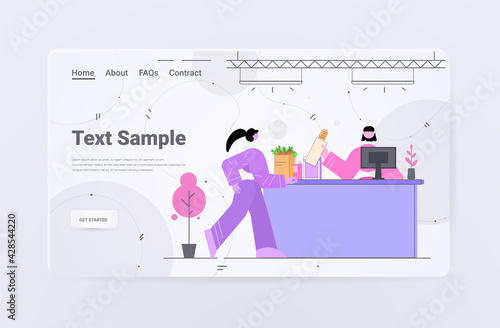 woman shopping groceres in supermarket at cash desk with cashier concept horizontal copy space