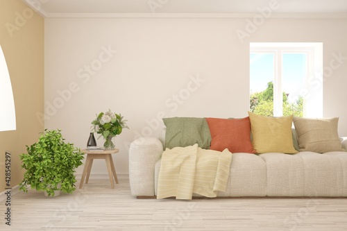 White living room with sofa and summer landscape in window. Scandinavian interior design. 3D illustration