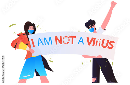 stop asian hate activists in masks protesting against racism support people during coronavirus pandemic concept