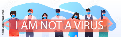 stop asian hate mix race activists in masks protesting against racism support people during coronavirus pandemic