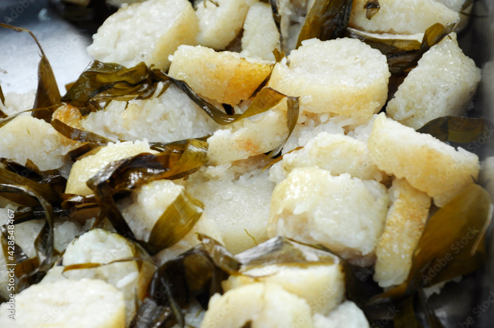 Malaysian famous traditional food called lemang. Glutinous rice wrapped with banana leave and cook & steamed in bamboo. Malaysian famous traditional food called lemang. Glutinous rice wrapped with banana leave and cook & steamed in bamboo.