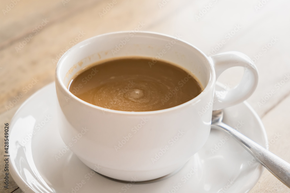 Coffee in a cup on a wooden table for breakfast. Coffee in a cup on a wooden table for breakfast.