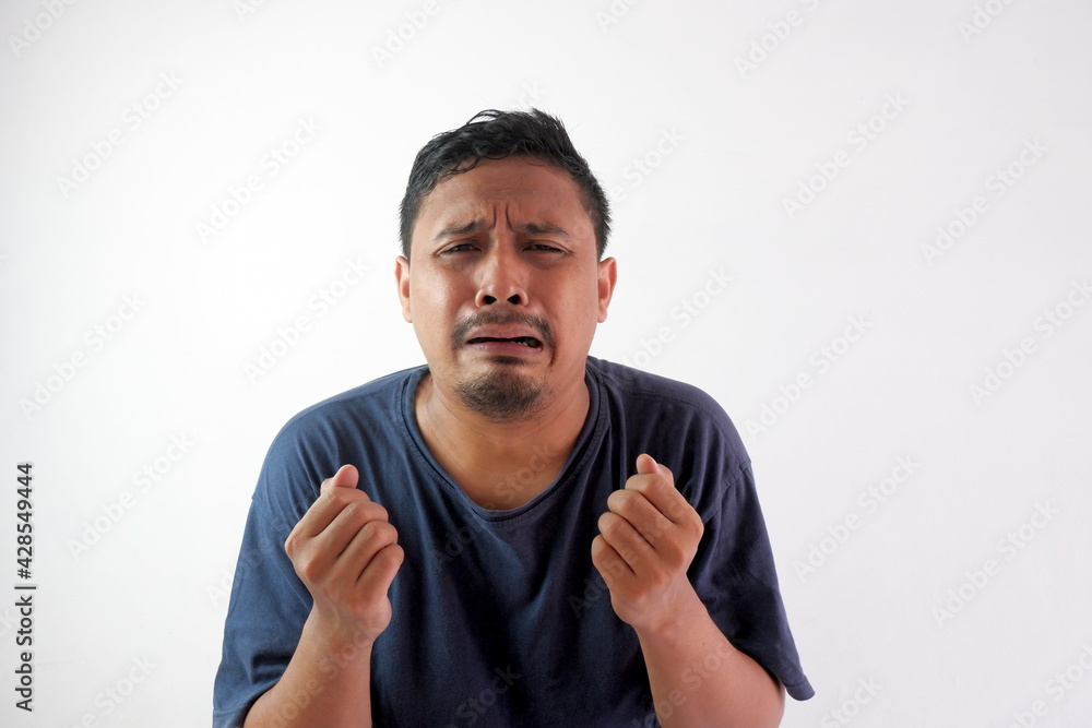 funny handsome man sad and crying , emotional asian guy funny handsome man sad and crying , emotional asian guy