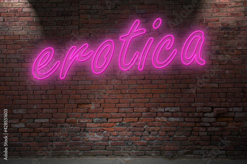 Fotografija Neon erotica lettering on Brick Wall at night
