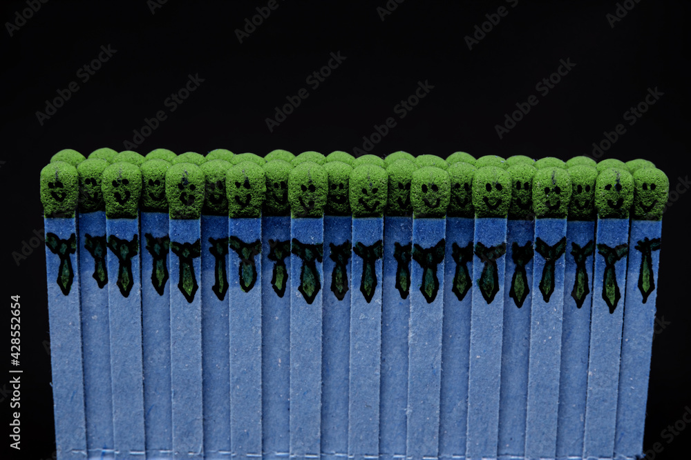 Fototapeta premium blue matchsticks with faces painted on the heads