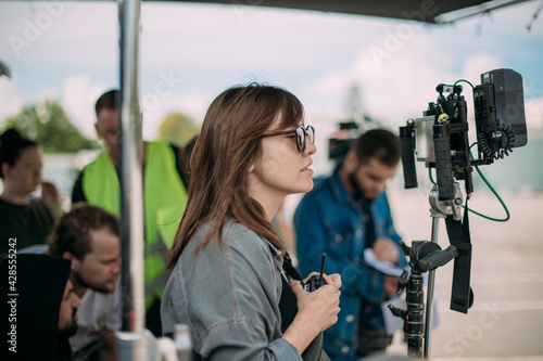 Director at work on the set. The director works with a group or with a playback while filming a movie