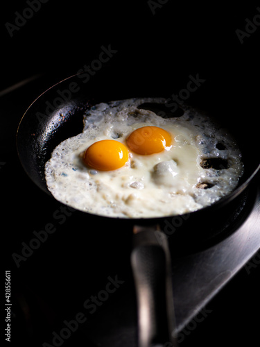 beautiful fried eggs in pan