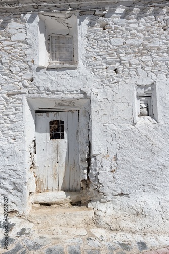 Fototapeta Naklejka Na Ścianę i Meble -  door and windows of old whitewashed farmyard in white color