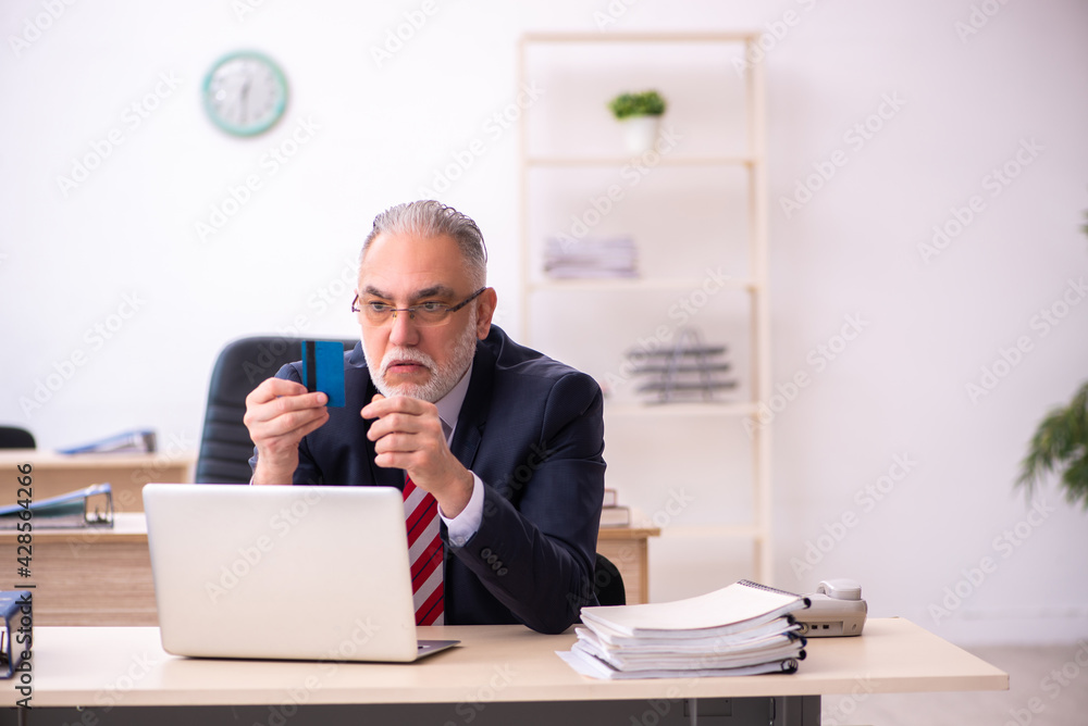 Old businessman employee in ecommerce concept Old businessman employee in ecommerce concept