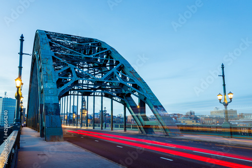 Newcastle upon Tyne UK: 16th March 2021: Tyne Bridge long exposure with blurred traffic during rush hour and blue hour. Colourful and bright