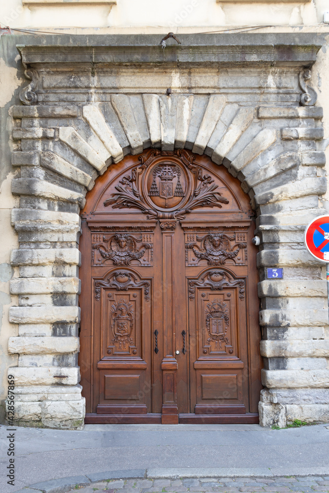 Facade of a old door made of wood in Old Lyon France