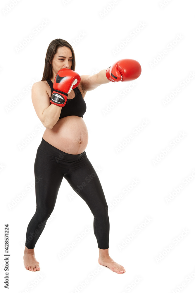 Pregnant woman doing fitness exercises Pregnant woman doing fitness exercises