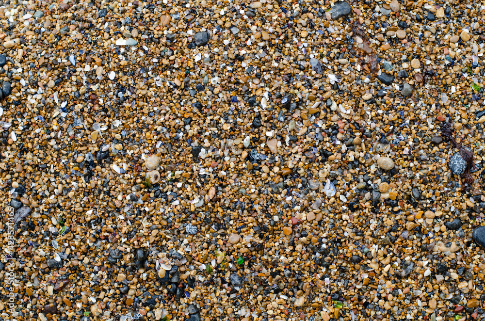 Sea pebbles. Pebble beach. Decorative sea stones. The structure of the stone. Sea pebbles. Pebble beach. Decorative sea stones. The structure of the stone.