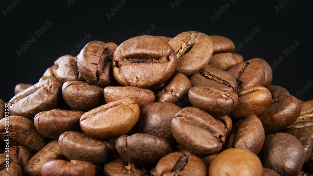 Roasted coffee beans turning background 4K Roasted coffee beans turning background 4K