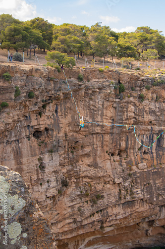 Acrobatics on a tightrope over a crater 55meters high at Lavrio, Greece