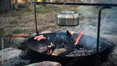 Metal kettle on a campfire