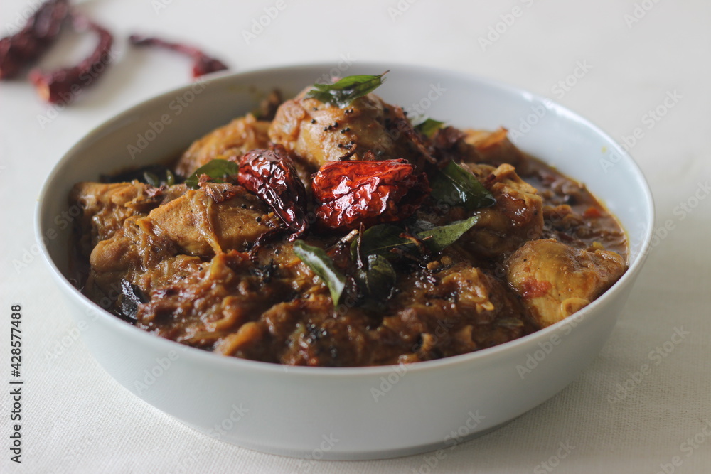 Kerala style chicken curry in coconut oil with homemade masala powder. Kerala style chicken curry in coconut oil with homemade masala powder.