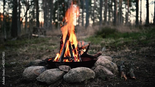 Metal kettle on a campfire