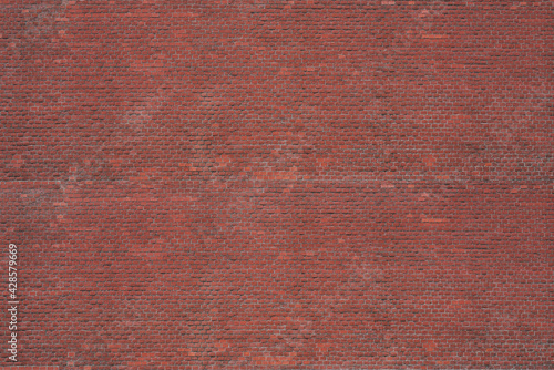 Brick wall background. Texture of a red brick wall. Construction, design and interior concept
