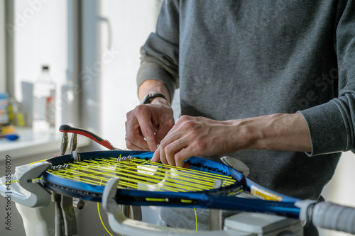 Obraz na płótnie Close-up of tennis racket on electronic stringing machine