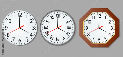 Set and wall clock in realistic style.Round and octagonal wall clock with shadow on gray background.Time accuracy is a modern concept.Vector illustration.