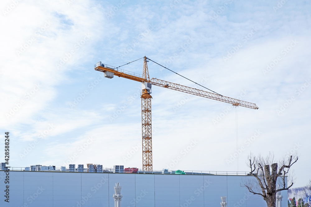 crane working on a building complex crane working on a building complex