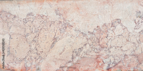 Texture of red and yellow marble. Stone tile with natural pattern. Marble pavement closeup.