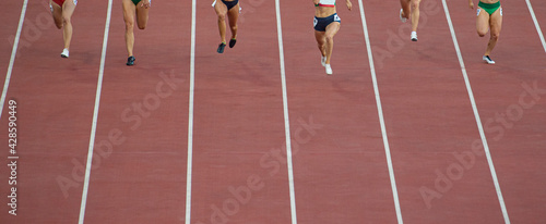 Obraz na płótnie Running woman sprinters runners in 100 meters