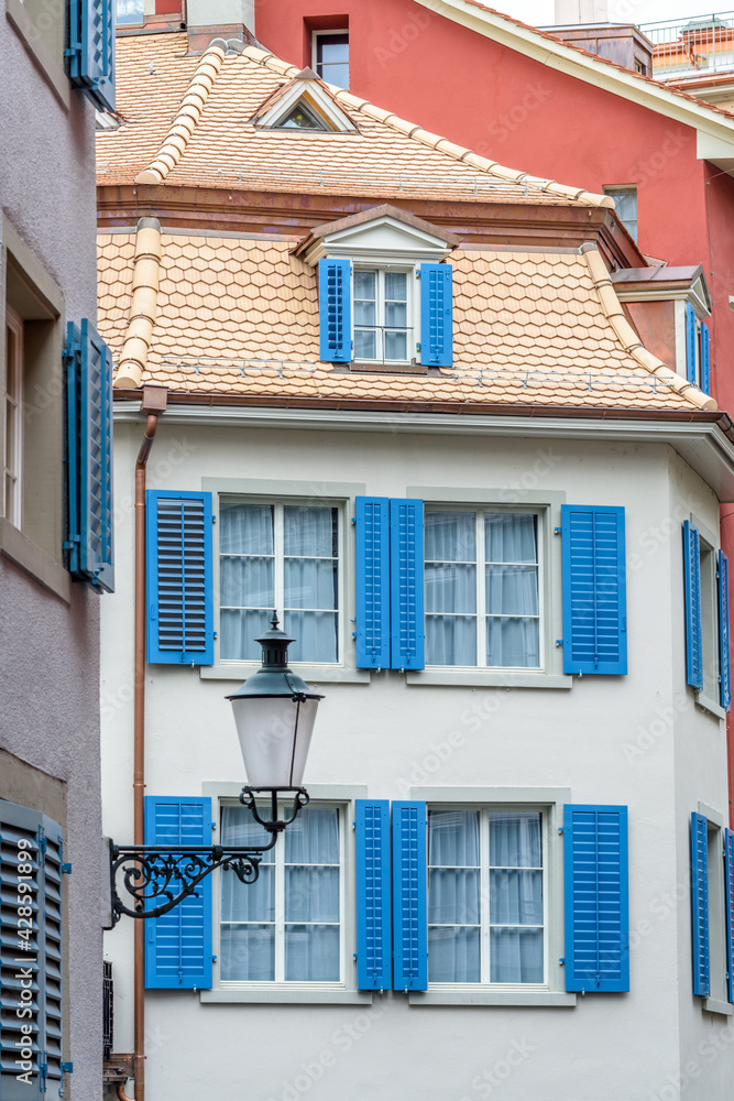 View of historic Zurich city center  on a cloudy day in summer, Canton of Zurich, Switzerland. An old window.