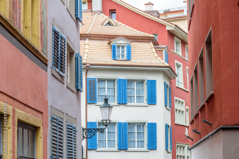 View of historic Zurich city center  on a cloudy day in summer, Canton of Zurich, Switzerland. An old window.