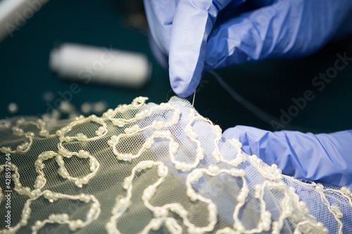 bride and groom hand with knitting needles