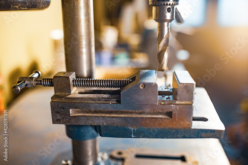 Drilling machine at the workplace of a toolman locksmith