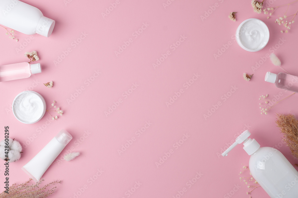 Cosmetic background with skin care products on pink. Flat lay, copy space  Stock Photo | Adobe Stock
