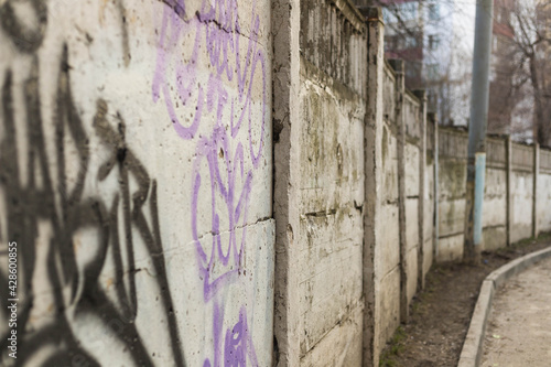 old peeling wall with graffiti  © AleksandrPrasolov